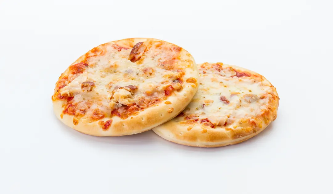 Hacer pizzas es una de las opciones más ricas para cocinar en familia.