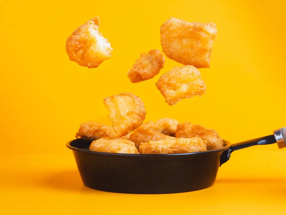 Aunque populares en todo el mundo, los nuggets fueron inventados en EE.UU. en los años 50 por un científico alimentario llamado Robert C. Baker. Una receta única